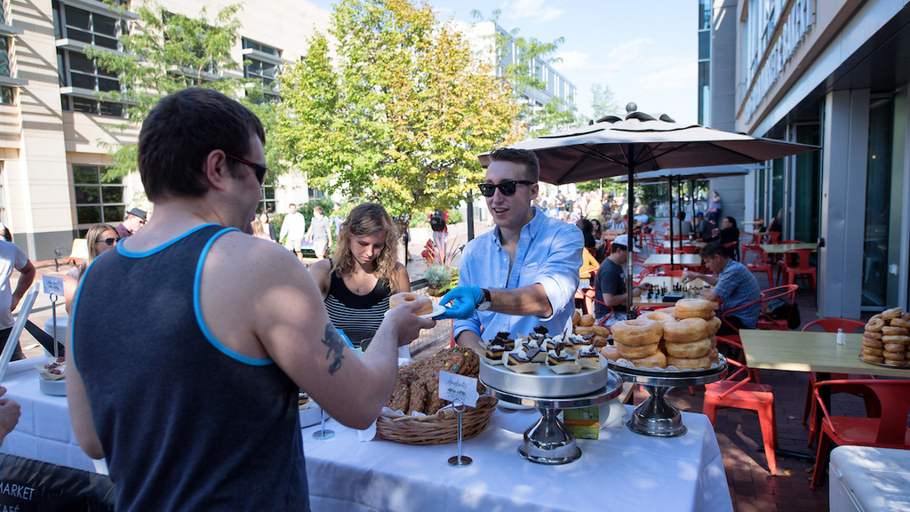 serving food at taste of iowa city event